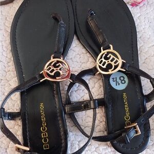 BCBGeneration Black and Gold Sandals